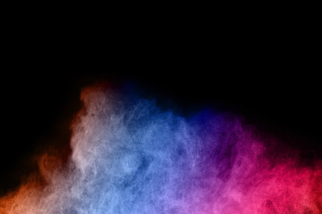 Fototapeta premium abstract colored dust explosion on a black background.abstract powder splatted background,Freeze motion of color powder exploding/throwing color powder, multicolored glitter texture.