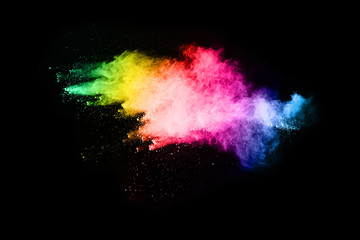 abstract colored dust explosion on a black background.abstract powder splatted background,Freeze motion of color powder exploding/throwing color powder, multicolored glitter texture. © kitsana