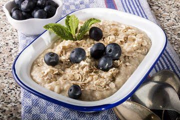 porridge made with traditional irish oatmeal in an enamel bowl