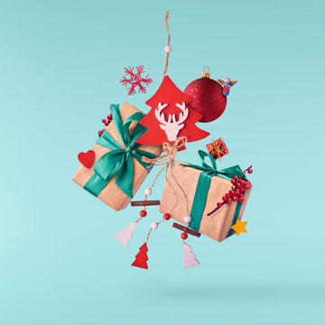 Christmas concept.  Creative Christmas conception made by falling in air gift boxes, christmas decorations and toys