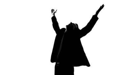 Man in suit raising hands full of happiness, got lucky, successful startup