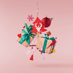 Christmas concept.  Creative Christmas conception made by falling in air gift boxes, christmas decorations and toys