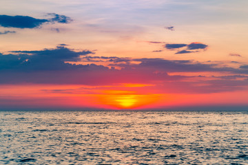 Sunset over ocean skyline, beautiful natural landscape background