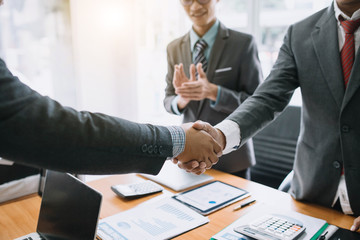 Business people shaking hands. Group of business successfully complete. The agreement and investment together in the meeting