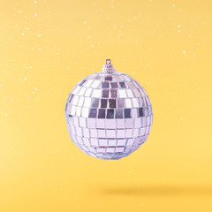 Fototapeta na wymiar Christmas concept. Creative Christmas conception made by falling in air shiny disco ball