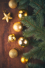 Christmas background. A lot of gold baubles and fir tree