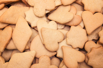 Tasty homemade cookies of different shapes - heart, moon, star, flower, rhombus - baked for Christmas