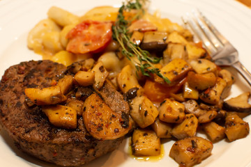 Closeup Steak and mushrooms with Gnocchi pasta healthy eating one serving