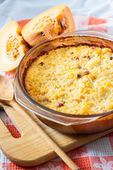 Baked milky cereal porridge with pumpkin and raisins