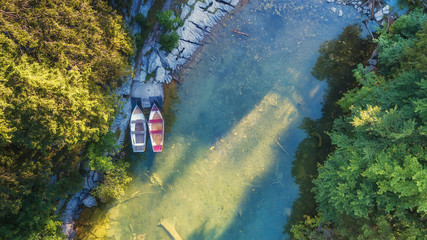 Aerial view on the lake and boats. Natural landscape from drone. Aerial landscape from air in the Switzerland