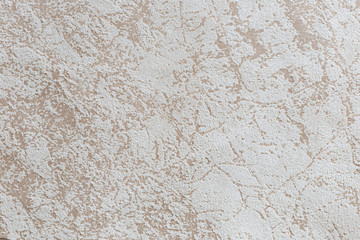 Beige texture of faux suede with an abstract pattern for background and design.