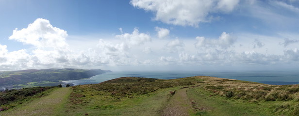 View from Selworthy Beacon, England UK near Exmoor and west of Minehead on the south west coast path with purple heather