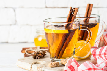 Autumn hot tea with lemon honey and spices