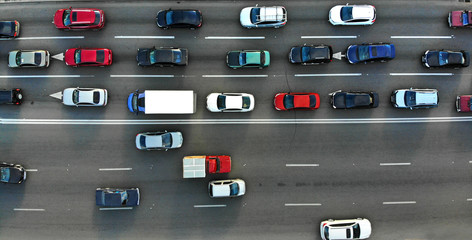 City traffic jam on a highway. Aerial. - Powered by Adobe