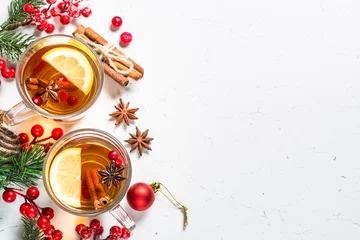 Foto op Plexiglas Winter hot tea with fruit, berries and spices on white table. © nadianb