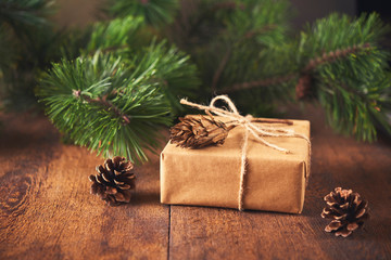 Fototapeta na wymiar gift boxes, fir tree and decoration on wooden background. Christmas concept