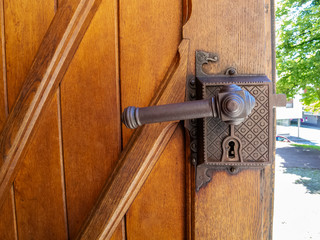Decorated door lock of the entrance door of the Parish Church of the Sacred Heart of Jesus,...
