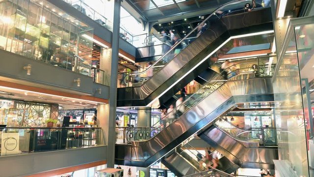 Time lapse of people using escalators at Siam Center shopping mall