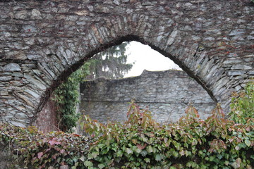 Brick archway with green plants