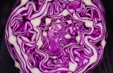 Fototapeta premium Appetizing fresh salad of blue cabbage and green parsley with olive oil.