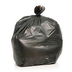 A black trash bag on a white background. Isolation