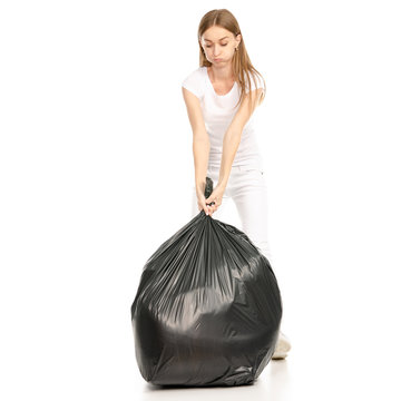 Woman in hand trash bag on a white background. Isolation