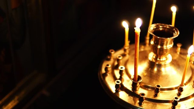 Orthodox Church, candles in the candlestick in slow motion