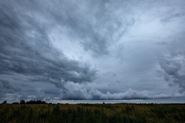 Obraz na płótnie Canvas storm clouds forming over the countryside