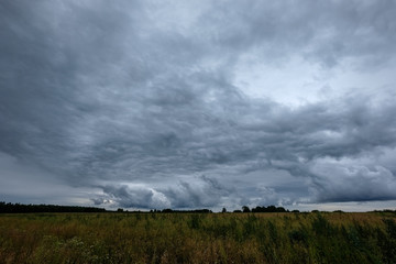Obraz na płótnie Canvas storm clouds forming over the countryside