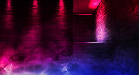 A narrow empty corridor, an old brick wall, smoke, neon lights and lamps. Night view. Background of an empty corridor with brick walls and neon light. Brick walls, neon rays and glow