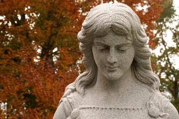 Fototapeta premium tombstones with angels and figures in victorian graveyard