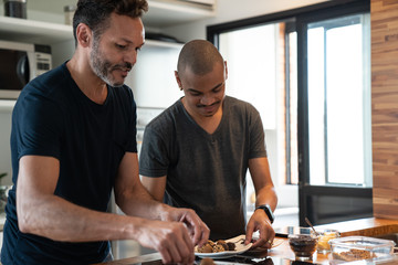 Gay Couple Preparing Brigadeiro Dessert at Home