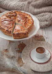 fall cozy day with cup of coffee, book and delicious pie