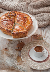 fall cozy day with cup of coffee, book and delicious pie