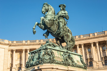 Fototapeta premium Statue of Prince Eugene of Savoy in front of Hofburg Palace in Vienna, Austria, sunny day, blue sky
