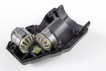 Wheels for mechanical gears on a white workshop table. Mechanical parts for mechanical devices.