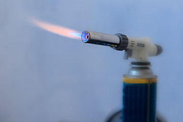 Naklejka premium Burning gas, gas burner, burns a hundred dollars. The concept of problems with natural gas, increasing prices and gas losses.