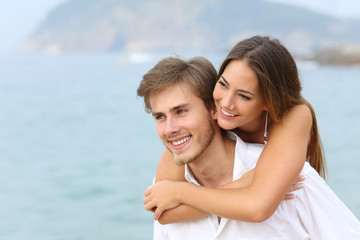 Happy couple joking on summer vacation