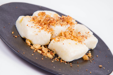 Dumplings with cottage cheese (traditional polish dish called lazy pierogi/ leniwe pierogi) fried with bread crumbs