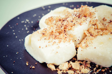 Dumplings with cottage cheese (traditional polish dish called lazy pierogi/ leniwe pierogi) fried with bread crumbs and sprinkled with sugar