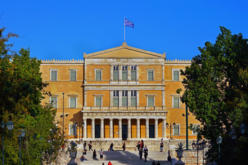 Athens, Greece - October 06, 2014 People walking in Syntagma square with the Greek parliament building as a background