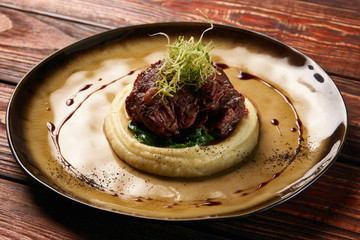 Jerusalem Artichoke Puree, spinach and truffle oil with baked me