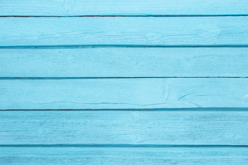 Horizontal baby blue wooden board background.