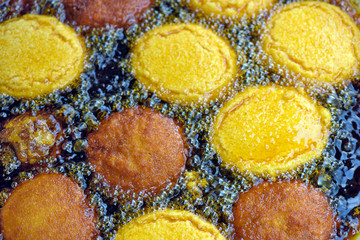 Brazilian food: acaraje fried on the board of baiana