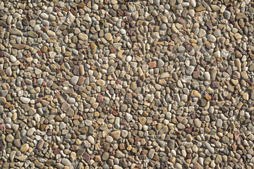 background made of a closeup of a wall with pebbles