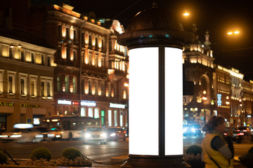 advertising pylon, advertising billboard on the street glowing at night. place to place your design