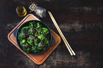 Broccoli baked in a cast iron skillet. Healthy Chinese style food. Vegan snack. Food sticks. Serve...
