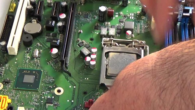 Technician Remove Cpu Microprocessor From A Motherboard Socket