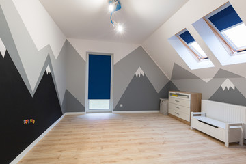 Kids bedroom with painted mountains on the wall