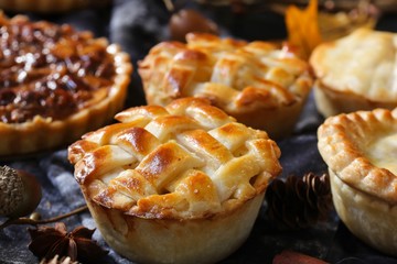 Background with various mini muffin pies / Thanksgiving desserts frame - obrazy, fototapety, plakaty